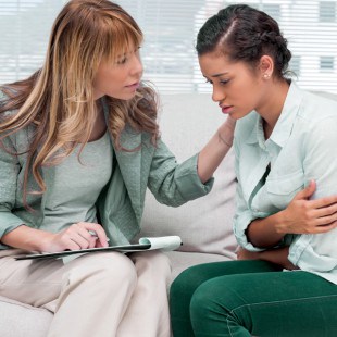 concerned woman comforting upset client