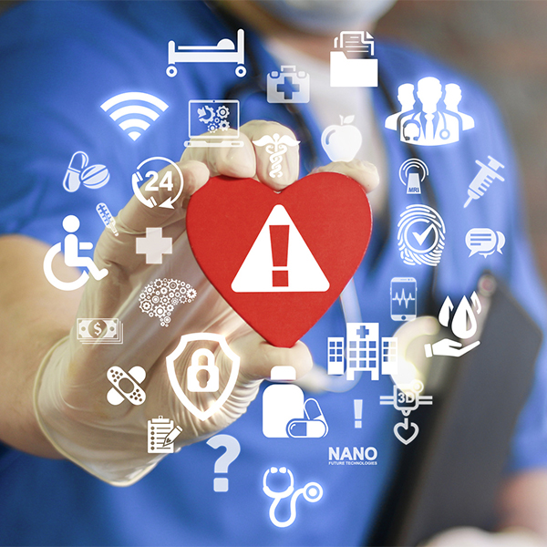 A healthcare professional in blue scrubs holds a red heart with a warning sign, surrounded by various medical and technology icons.