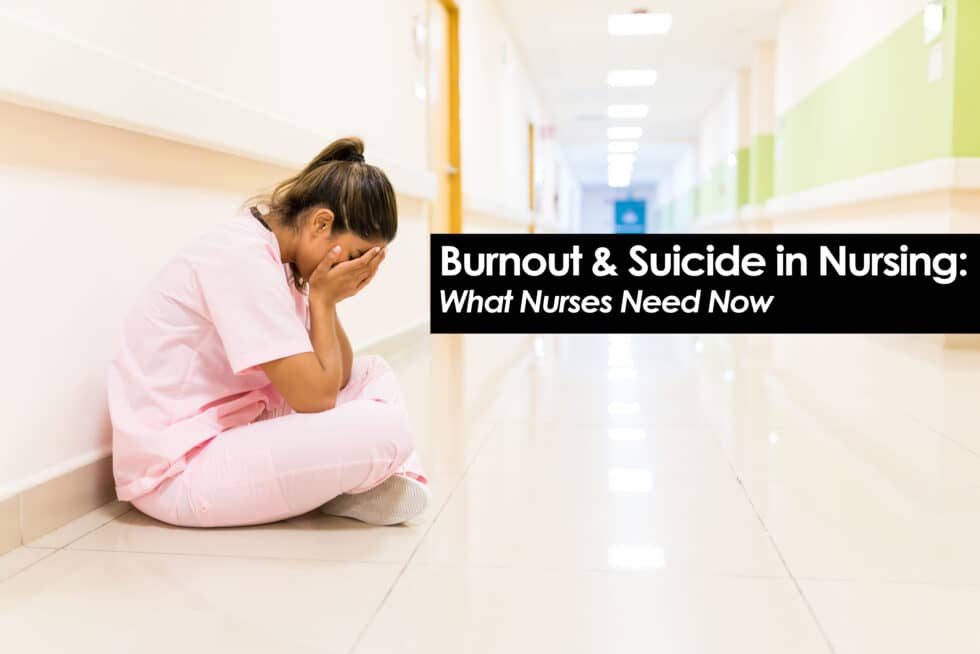 nurse crying leaning against hospital wall