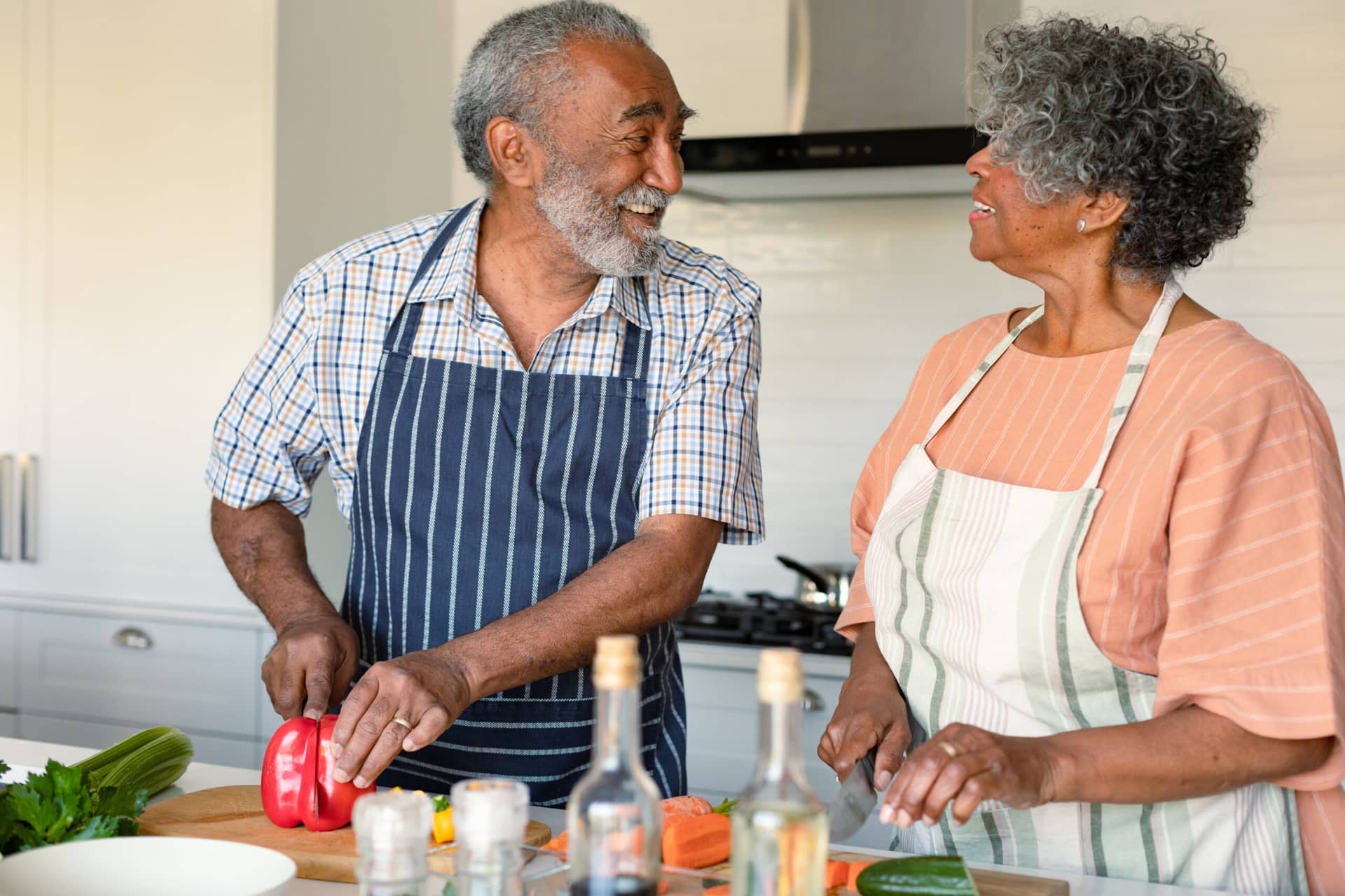 an elderly couple enjoying a cooking class 