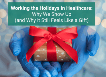 Healthcare worker wearing blue medical gloves holding a small wrapped holiday gift with a red ribbon, with soft festive lights blurred in the background and a green text banner that reads “Working the Holidays in Healthcare: Why We Show Up (and Why it Still Feels Like a Gift).”