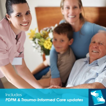Nurse in pink uniform smiling at a multi-generational family, including an elderly man, a young woman, and a boy, all seated together in a hospital room.