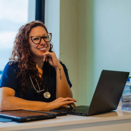 Skilled nursing nurse completing online continuing education to support staff development, compliance training, and quality long-term care.